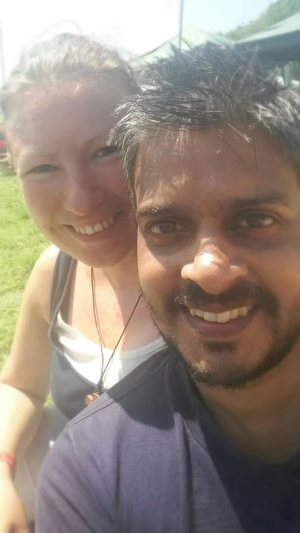 Andy and Mary smiling together outdoors